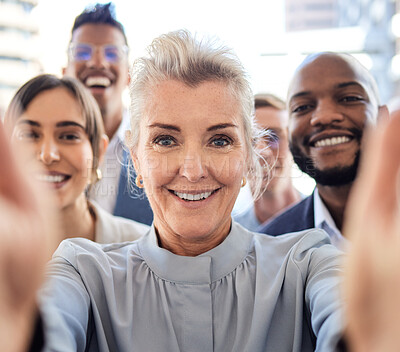 Buy stock photo Portrait of a group of businesspeople taking selfies together in an office