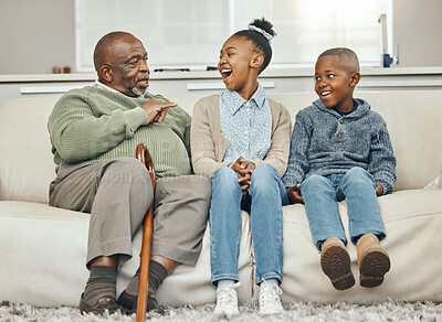 Buy stock photo Shot of a grandfather bonding with his grandkids on a sofa at home