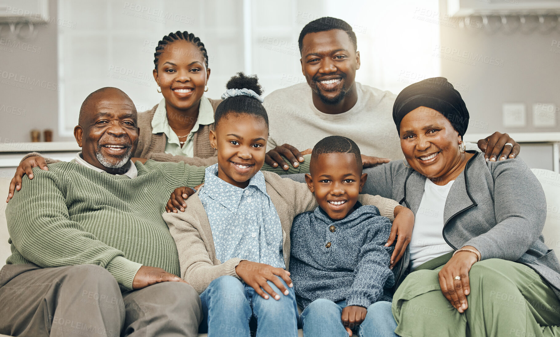 Buy stock photo African, portrait and smile with big family on sofa in living room of home together for bonding. Happy, love or visit with generations of senior people, parents and children in apartment for wellness