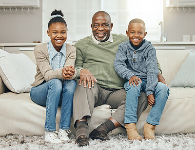 Buy stock photo Shot of a grandfather bonding with his grandkids on a sofa at home