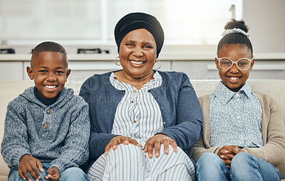 Buy stock photo Shot of a grandmother bonding with her grandkids on a sofa at home