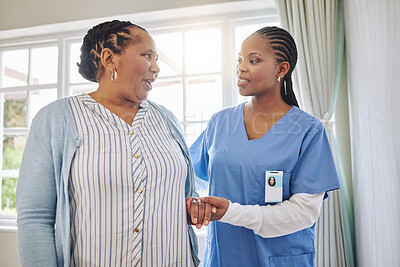 Buy stock photo Nurse helping senior patient to walk with support, healthcare and kindness at retirement home. Black person and caregiver together for trust, elderly care and help for rehabilitation and wellness 