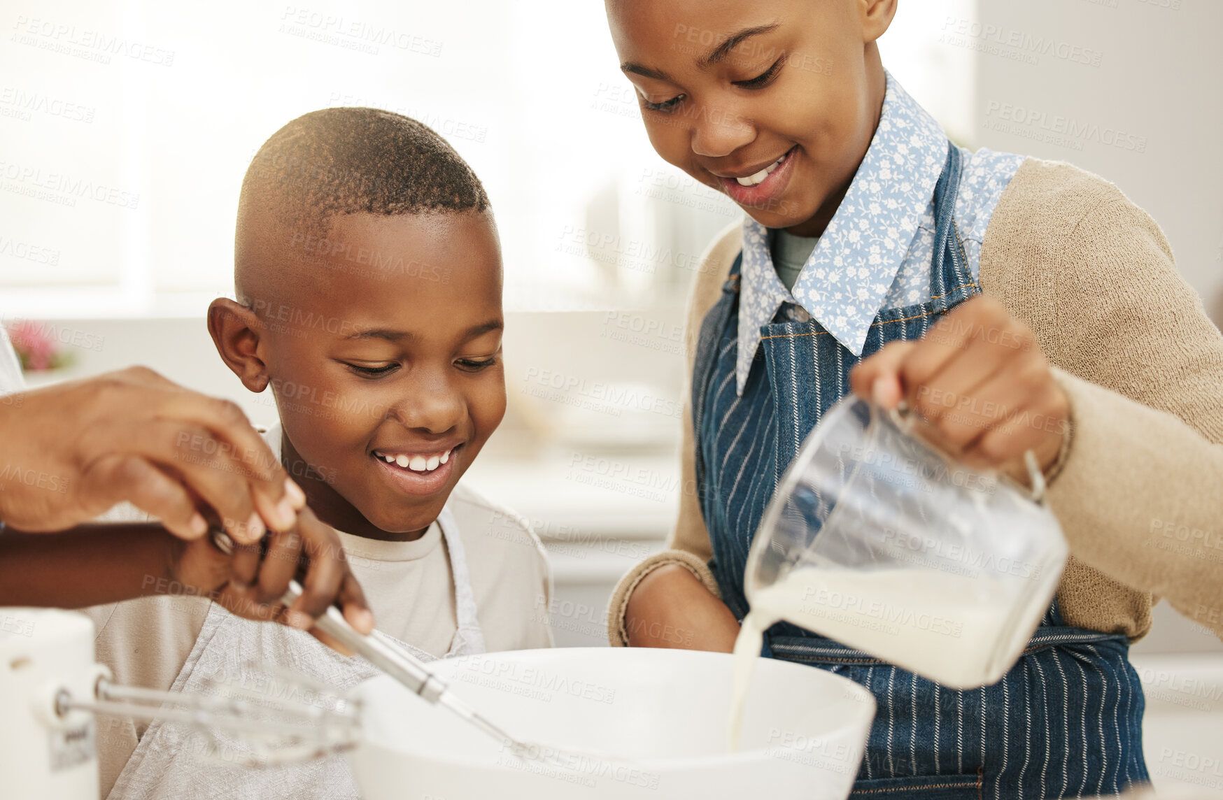 Buy stock photo Cropped shot of a grandmother baking with her two grandkids at home