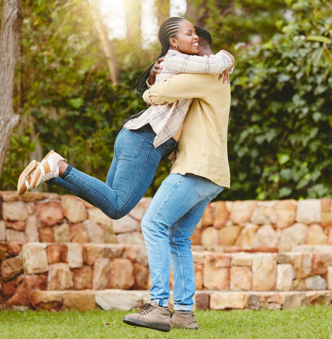 Buy stock photo Couple, lifting and hug for love, care and relationship with partner, security and bonding outdoor. Man, woman and smile for embrace, support and trust with commitment, loyalty and romance as date