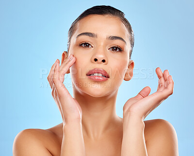 Buy stock photo Skincare, hands and portrait of woman in studio for beauty, glow and wellness or cosmetics. Model girl, laser and results for dermatology or chemical peel by blue background with shine from facial