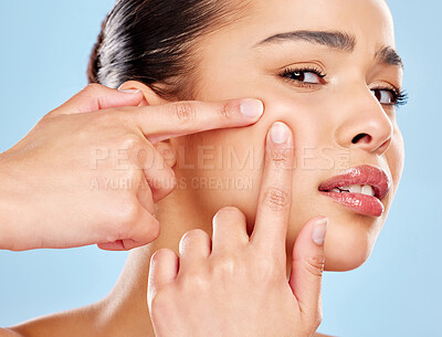 Buy stock photo Woman, portrait and pop pimple for acne problem with skincare check and skin health crisis in studio. Female person, breakout scar and face inspection with squeeze zit for beauty by blue background