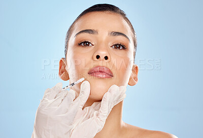 Buy stock photo Woman, portrait and needle in hand for plastic surgery with anti aging results and medical process in studio. Female patient, beauty transformation and injection for prp treatment by blue background