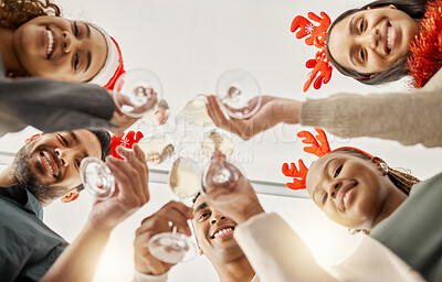 Buy stock photo Shot of a group of businesspeople celebrating during a Christmas party at work