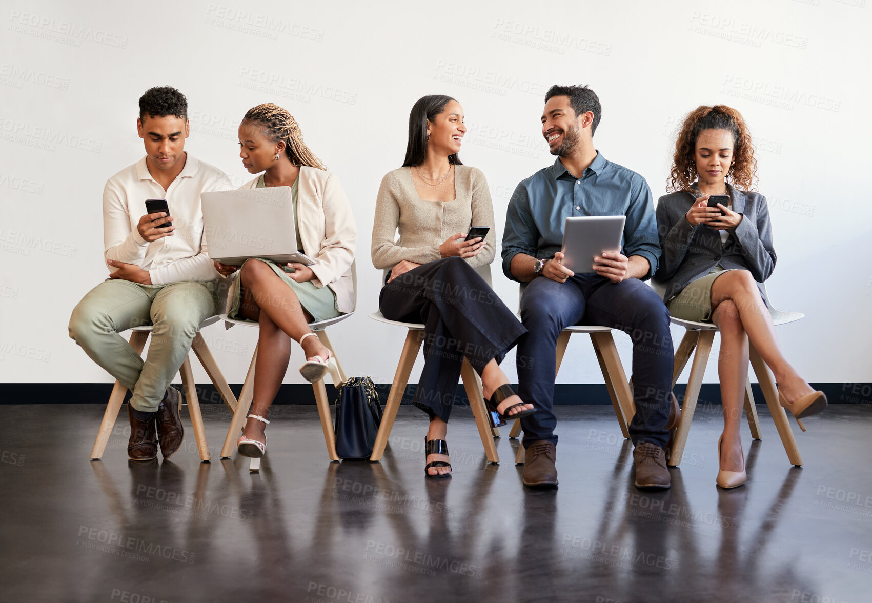 Buy stock photo Technology, hiring and recruitment with business people sitting in line waiting for a human resources meeting. Interview, online and talking with a happy candidate group in a row for a job vacancy