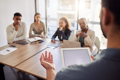 Buy stock photo Meeting, presentation and a business man with a tablet in the boardroom, talking to his team of colleagues. Workshop, coaching and teaching with a male manager in the office during a training seminar