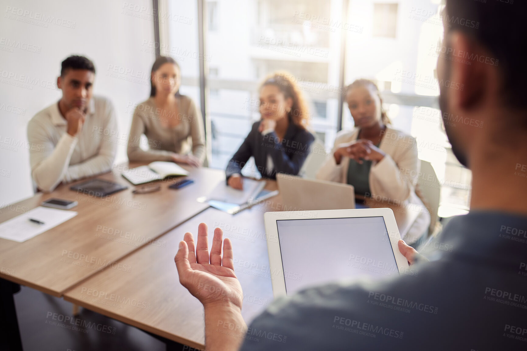 Buy stock photo Meeting, presentation and a business man with a tablet in the boardroom, talking to his team of colleagues. Workshop, coaching and teaching with a male manager in the office during a training seminar