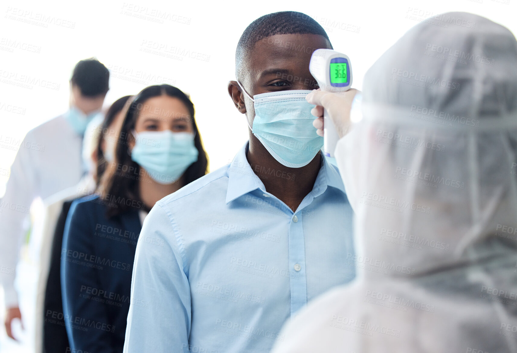 Buy stock photo Business people, group and check temperature for safety, health and security for wellness in pandemic in work office. Team, protection and thermometer in line for covid, virus and sick agent in mask