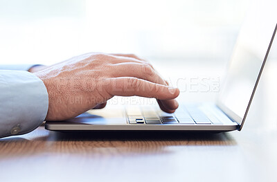 Buy stock photo Shot of an unrecognizable businessperson using a laptop at work