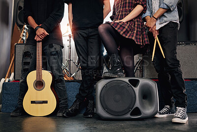 Buy stock photo Closeup, artist and band on stage, gig and performance with instrument, festival and speaker. Group, people and legs with team, creativity and guitar with talent, rock and roll with culture and music