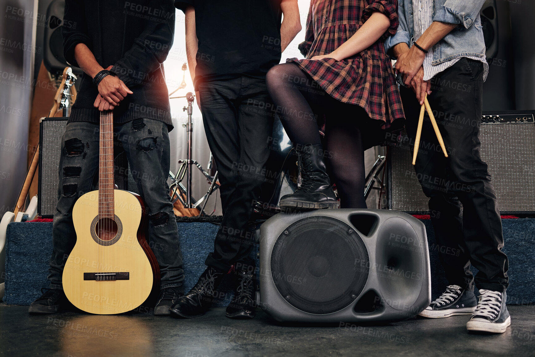 Buy stock photo Closeup, artist and band on stage, gig and performance with instrument, festival and speaker. Group, people and legs with team, creativity and guitar with talent, rock and roll with culture and music