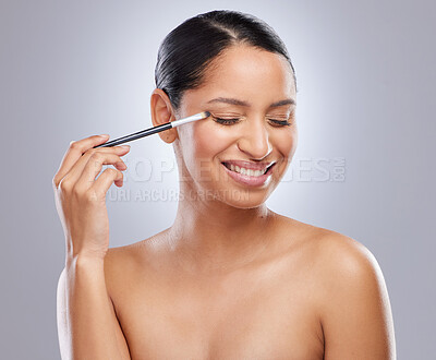 Buy stock photo Woman, face and makeup with brush, beauty and cosmetic tools and eyes closed in studio background. Model, person and happy or smile for transformation or eyeshadow, body and health for self care