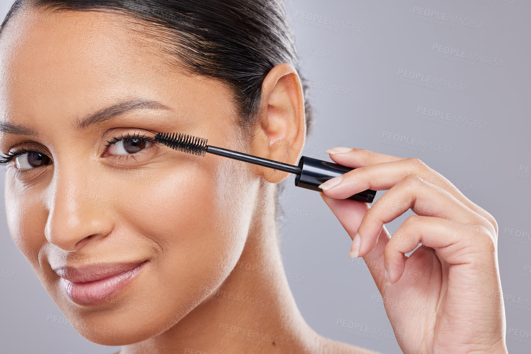 Buy stock photo Portrait, mascara and woman with brush in studio for makeup, cosmetics and results on grey background. Eyelash, beauty and face of Indian female model with tool for treatment, application or volume