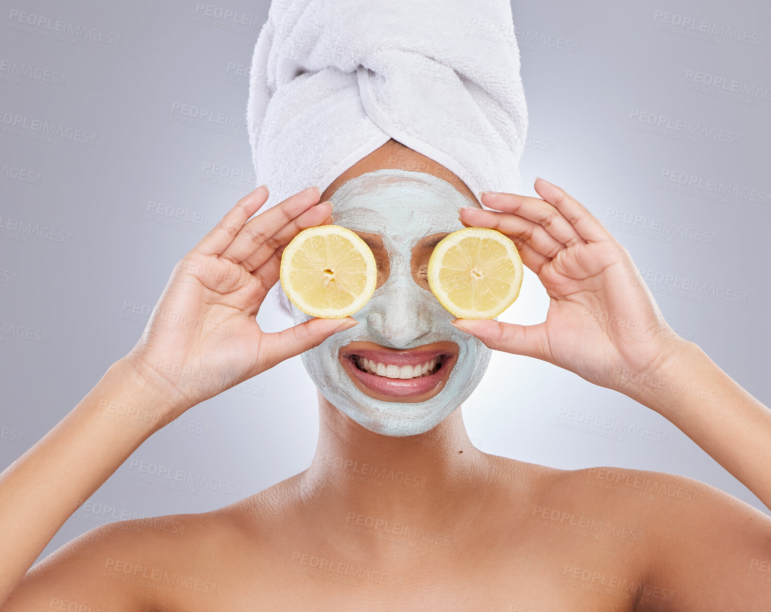 Buy stock photo Mask, beauty and lemon with woman in studio for skincare, natural cosmetics and vitamin c. Self care, glow and spa with face of female model and citrus fruit on grey background for detox product