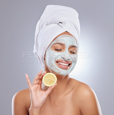 Buy stock photo Mask, skincare and lemon with face of woman in studio for beauty, natural cosmetics and vitamin c. Self care, glow and spa with female model and citrus fruit on grey background for detox product