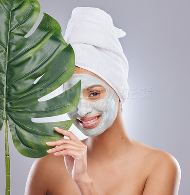 Buy stock photo Skincare, leaf and portrait of woman with face mask in studio for dermatology and treatment on grey background. Plant, facial and female model with organic, beauty and eco friendly wellness body care