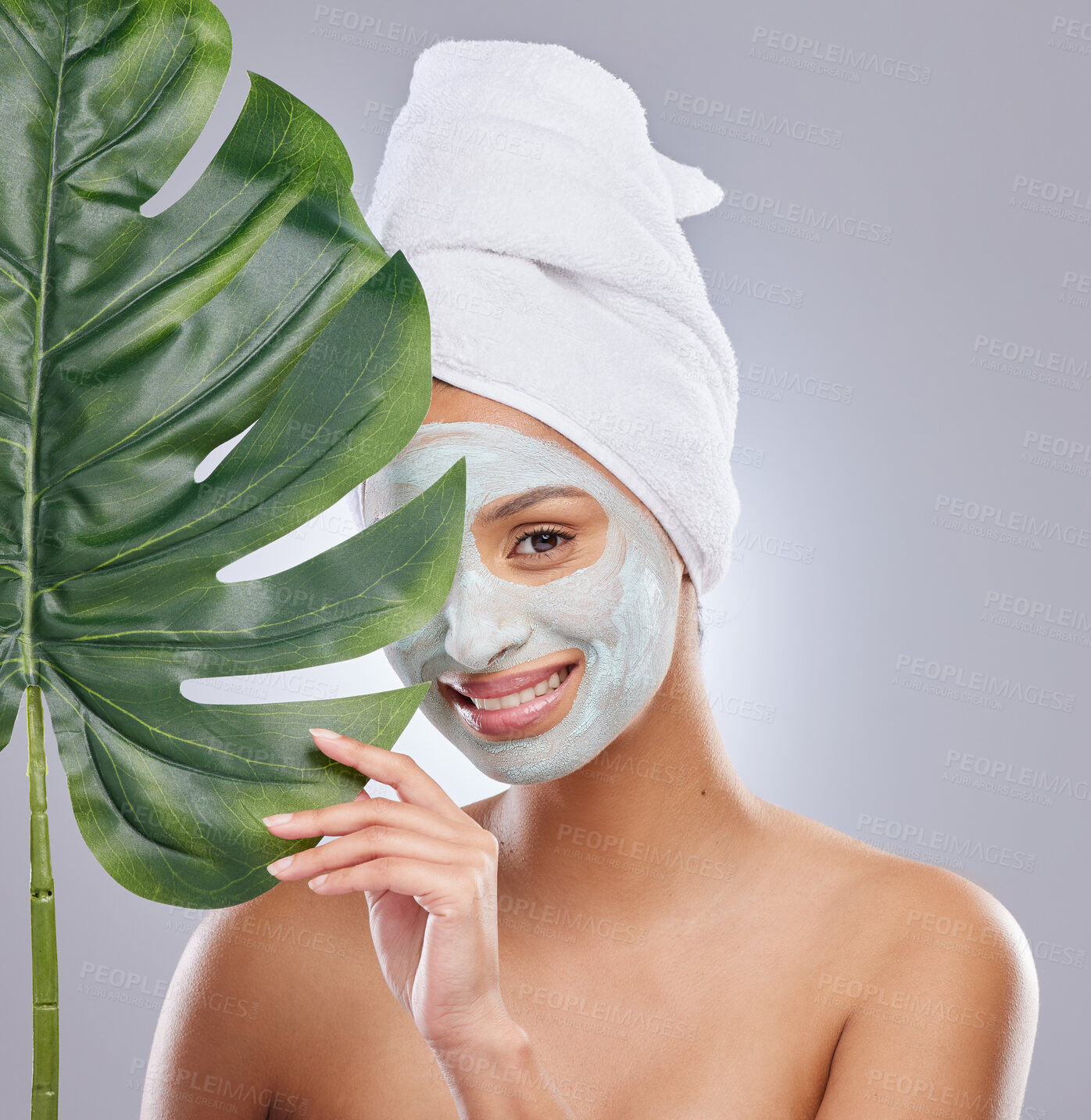 Buy stock photo Skincare, leaf and portrait of woman with face mask in studio for dermatology and treatment on grey background. Plant, facial and female model with organic, beauty and eco friendly wellness body care