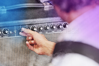 Buy stock photo Hand, person and volume on amplifier for music in concert, performance and equipment in studio. Sound engineer, speaker and producer with amp on stage for dj or technician for instrument enhancing