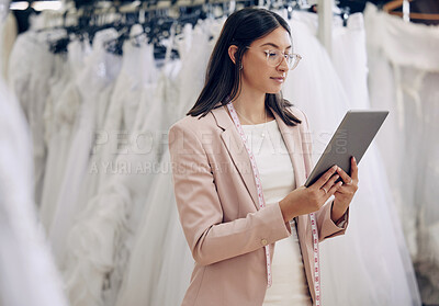 Buy stock photo Tablet, wedding dress and fashion designer woman in studio for online order or planning. Review, style and seamstress with tape measure in workshop for design research or fitting appointment