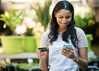Buy stock photo Credit card, phone and a woman with a payment at a nursery for stock, plants or shopping on the web. Ecommerce, pay and a happy business owner or customer buying a plant on sale on a mobile app