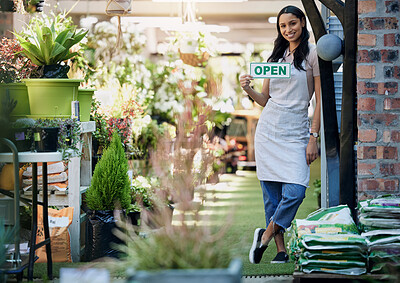 Buy stock photo Woman, portrait and open sign at nursery with small business, gardening and sustainability with welcome. Poster, notice and entrance with flower seller in retail, florist or entrepreneur with service