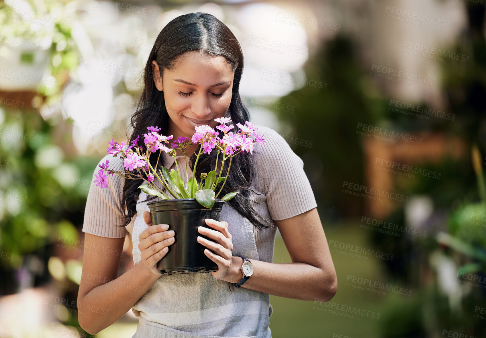 Buy stock photo Woman, happy and smelling flowers in nature for gardening, pot plant and ecology in outdoor store. Florist, female business owner and inventory in nursery for career, sustainability and eco friendly