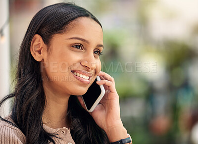 Buy stock photo Shot of a young florist using her smartphone to make a call