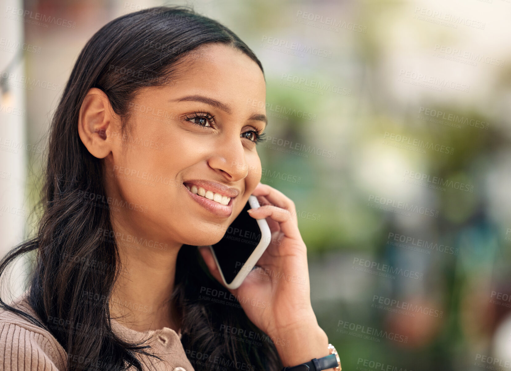 Buy stock photo Shot of a young florist using her smartphone to make a call