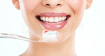 Buy stock photo Washing, teeth and smile of person, toothbrush and routine for hygiene in morning, studio and oral health. White background, toothpaste and cleaning of tooth, bacteria and dental for mouth and gums