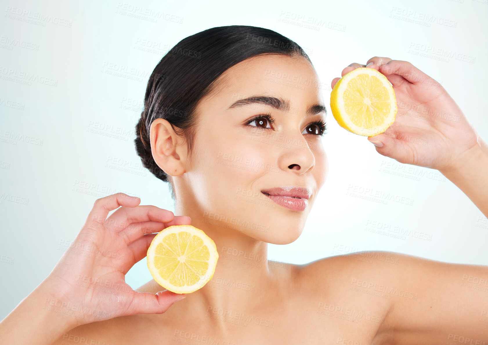 Buy stock photo Beauty, woman and lemon for skincare in studio with vitamin c, acne scarring and digestion. Model, citrus fruit and antifungal benefits for skin inflammation, facial glow and diet by white background