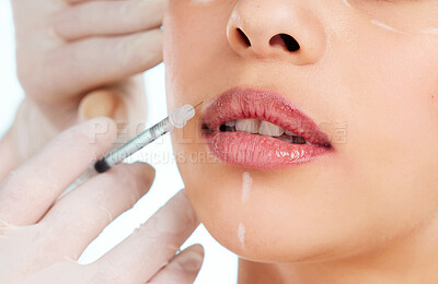 Buy stock photo Studio shot of an unrecognizable young woman having some plastic surgery done against a light background