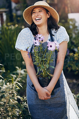 Buy stock photo Gardening, woman and holding plant in outdoor for environment, sustainability or ecology. Nature, laughing and female person with apron for green nursery, agriculture or landscaping in backyard