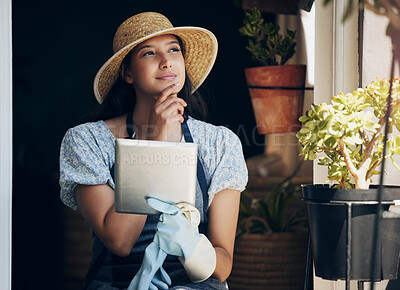 Buy stock photo Girl, florist and thinking with tablet in garden to order supplies, inventory management and market research for business. Female gardener, digital tech and thoughts or ideas for nursery planning.