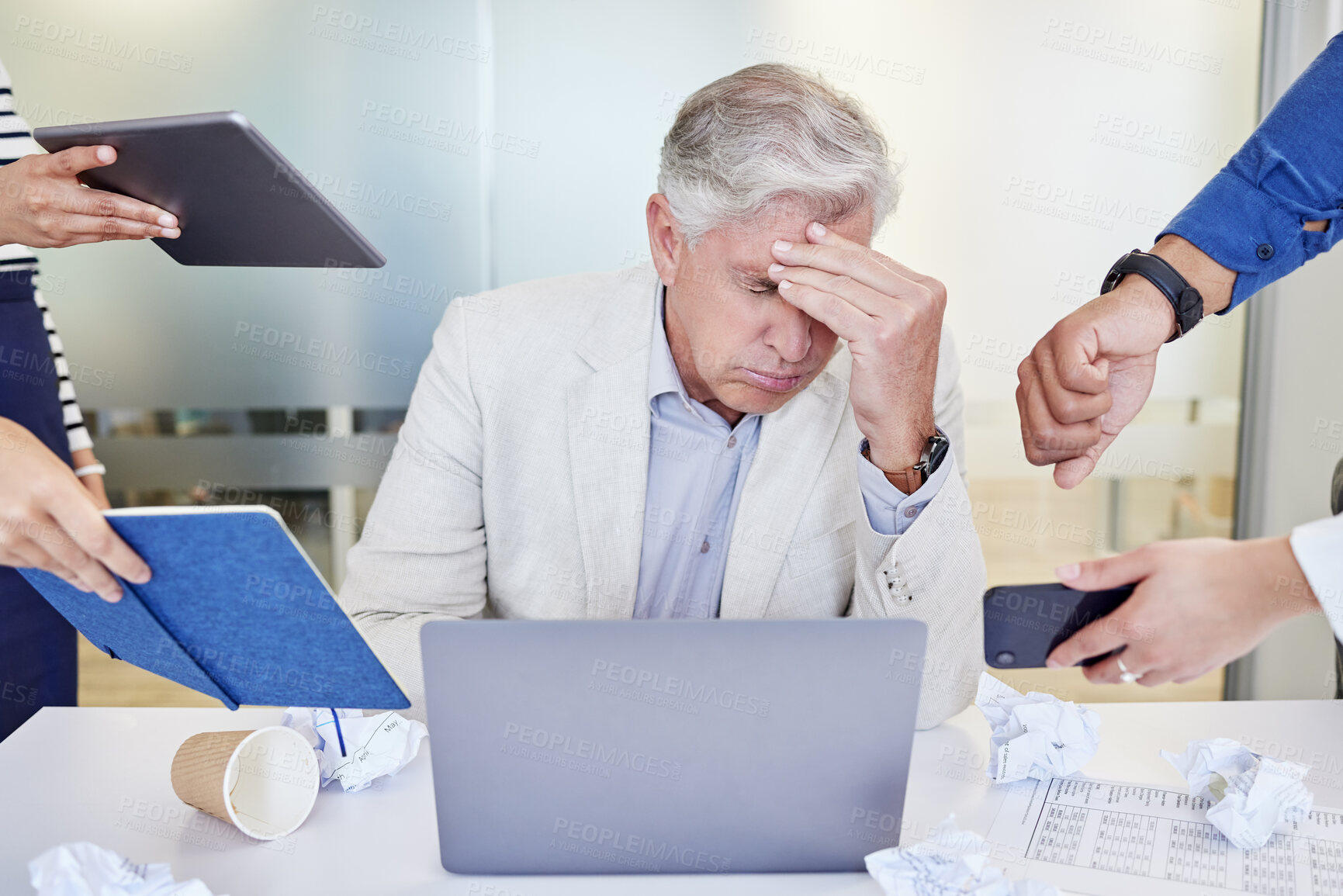 Buy stock photo Businessman, office and multitasking with chaos or working with laptop, burnout and overwhelmed at job. Male person, company and colleagues with report, stress with headache and poor mental health