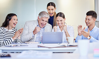 Buy stock photo Shot of a group of businesspeople cheering while using a laptop at work