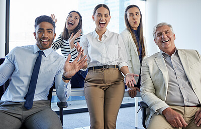 Buy stock photo Shot of a group of businesspeople looking cheerful at the office