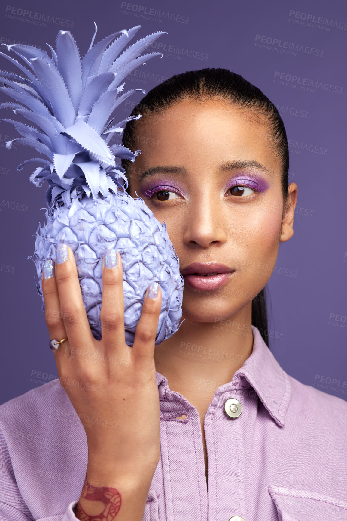 Buy stock photo Studio shot of a beautiful young woman modelling a purple colour concept