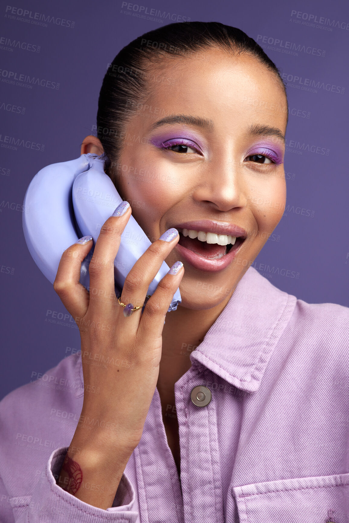 Buy stock photo Studio shot of a beautiful young woman modelling a purple colour concept