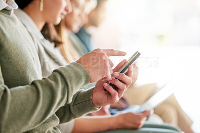 Buy stock photo Cropped shot of an unrecognisable group of businesspeople sitting in a row and using technology