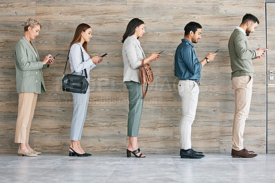 Buy stock photo Full length shot of a diverse group of businesspeople standing in a line together and using their cellphones