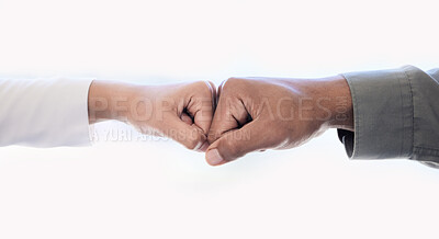 Buy stock photo Closeup shot of two unrecognisable businesspeople giving each other a fist bump in an office