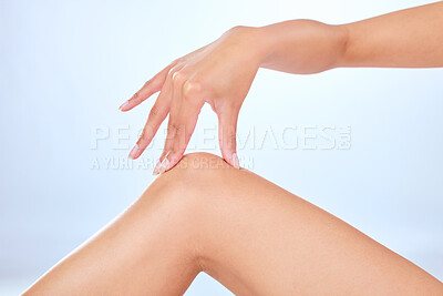 Buy stock photo Hand, knee and grooming for hair removal in studio, smooth and hygiene on white background. Leg, cosmetic and shaving for waxing or epilation, body care and wellness for pamper and salon treatment