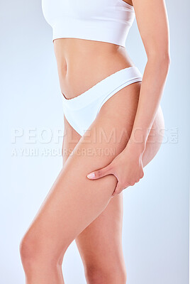 Buy stock photo Studio shot of an unrecognizable woman posing against a grey background