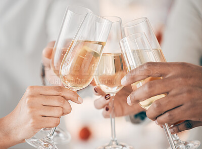 Buy stock photo Shot of a group of businesspeople celebrating while toasting with champagne at work