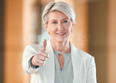 Buy stock photo Shot of a mature businesswoman showing a thumbs up at work
