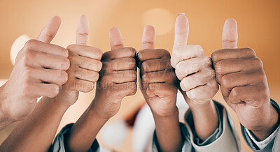 Buy stock photo Shot of a group of unrecognizable businesspeople showing a thumbs up at work